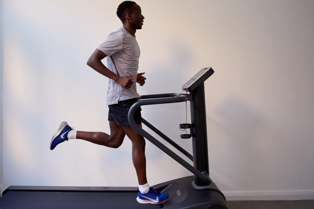 Client running on a treadmill during a physiotherapy running assessment at Movement Perfected Moorgate